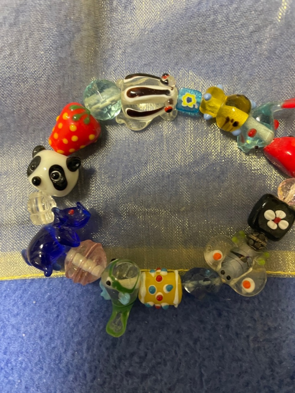Bright glass beads, panda pig fish, a fun bracelet. Children or adults.